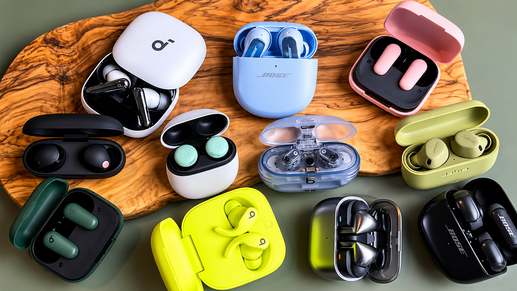 Comparison of true wireless earbuds case and earbuds on dark modern desk